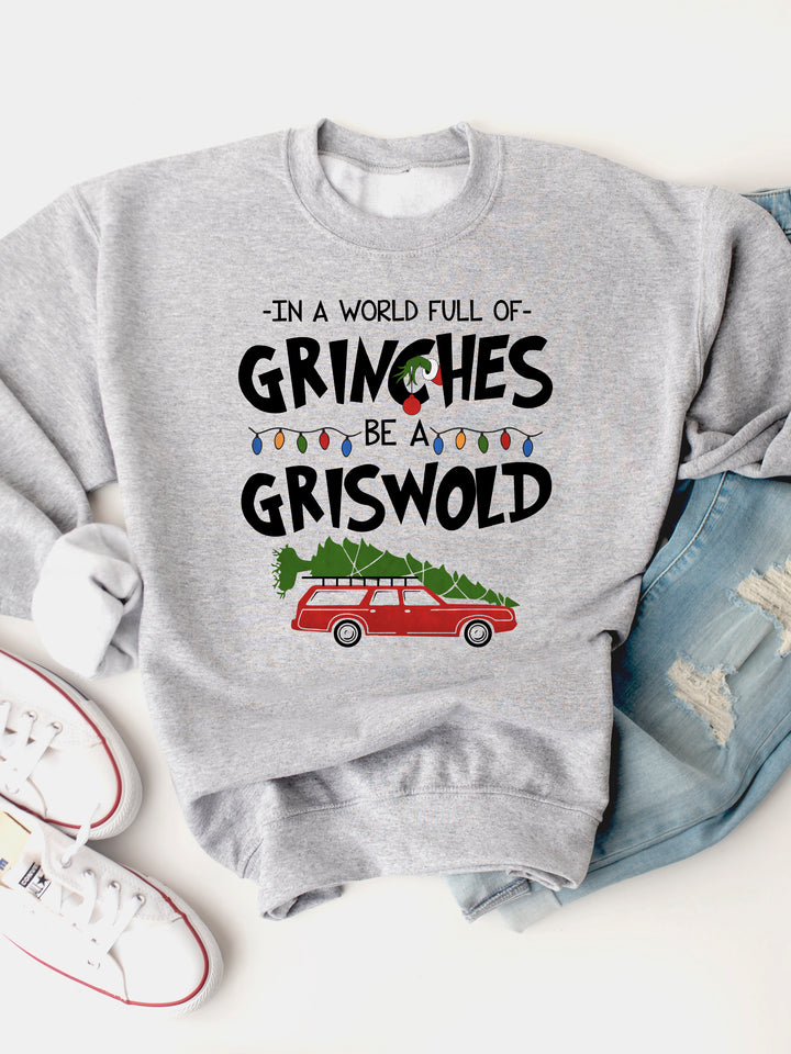 In A World Full Of Grinches, Be A Griswold Graphic Sweatshirt