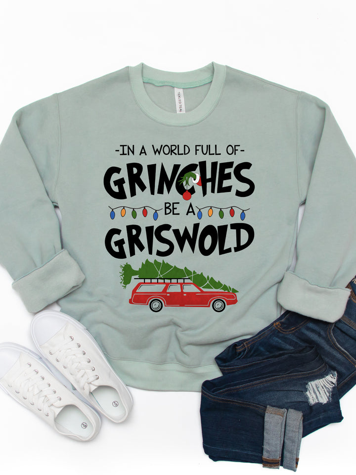 In A World Full Of Grinches, Be A Griswold Graphic Sweatshirt