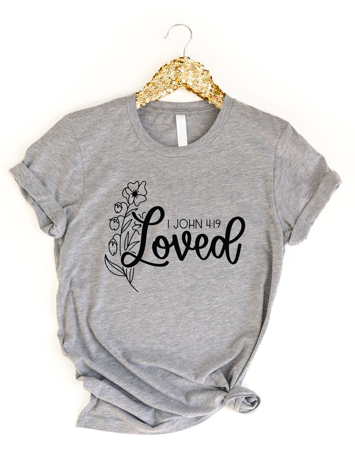 Loved 1 John 4:19 Graphic Tee