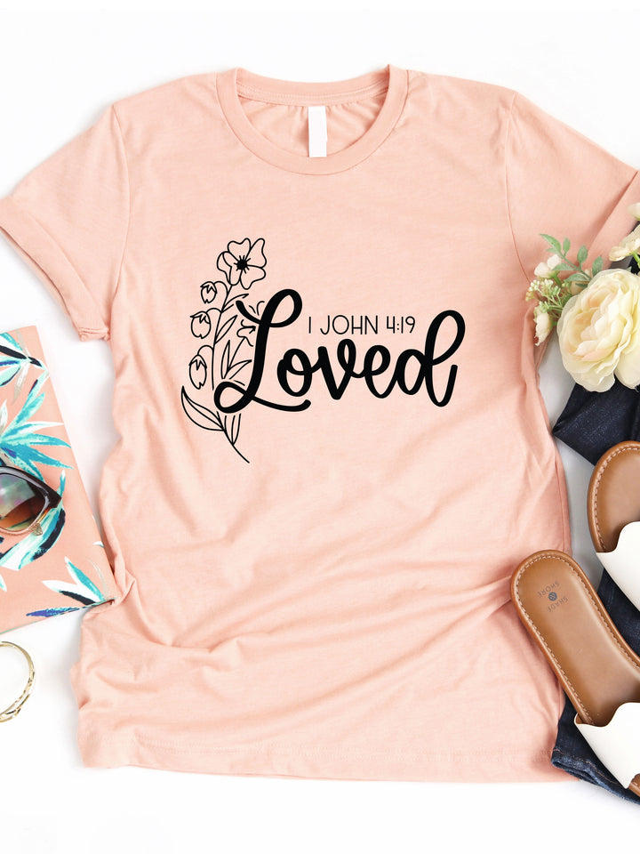 Loved 1 John 4:19 Graphic Tee