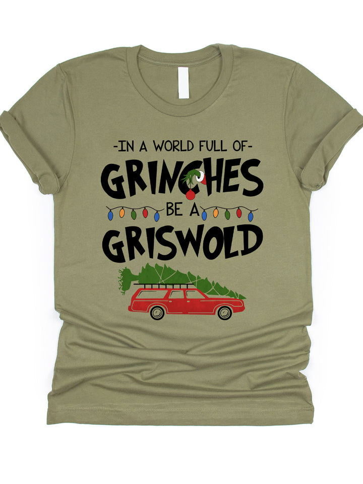 In a world full of Grinches Be a Griswold Graphic Tee