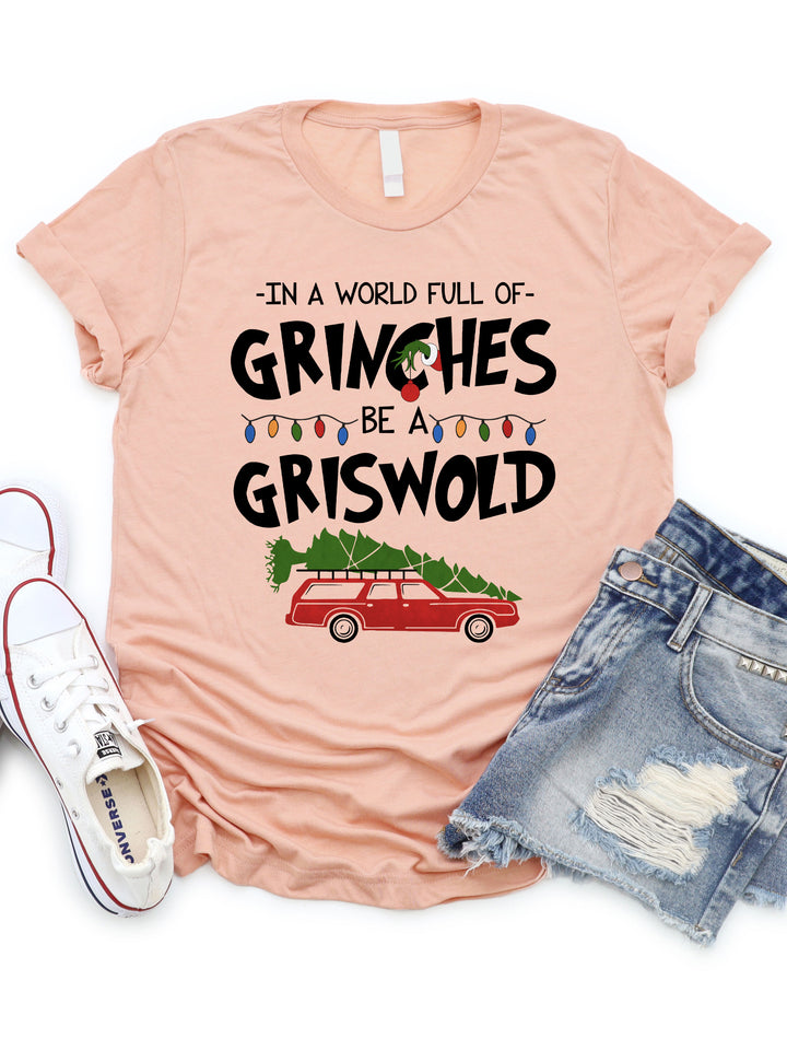 In a world full of Grinches Be a Griswold Graphic Tee