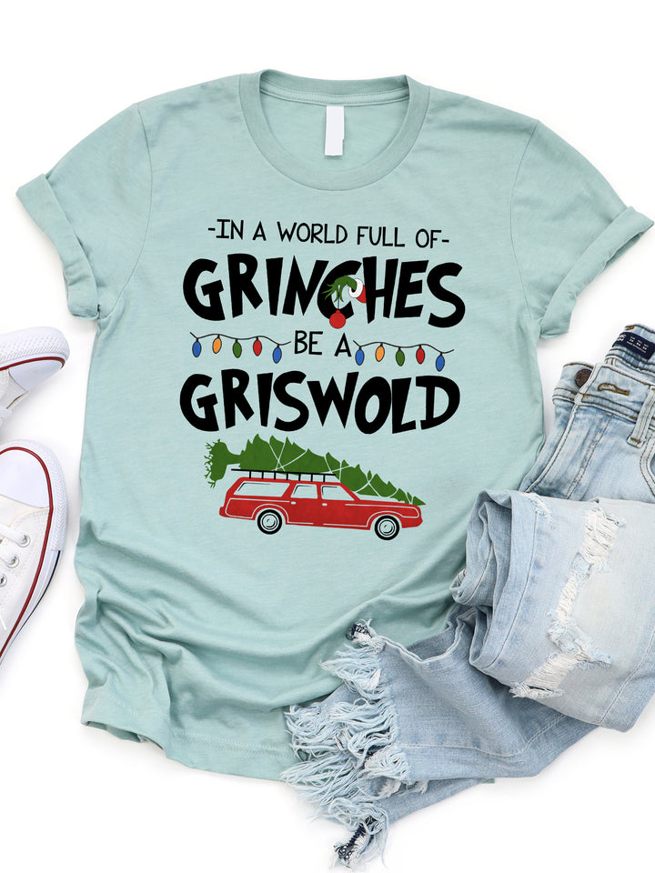 In a world full of Grinches Be a Griswold Graphic Tee
