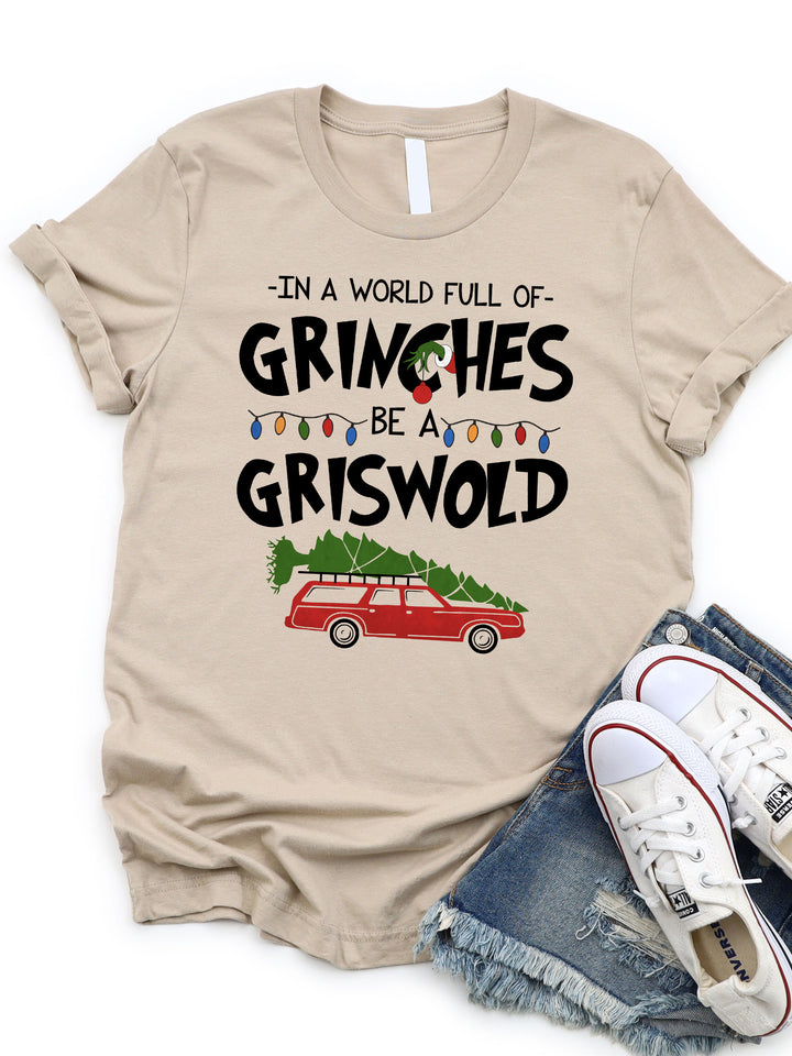In a world full of Grinches Be a Griswold Graphic Tee