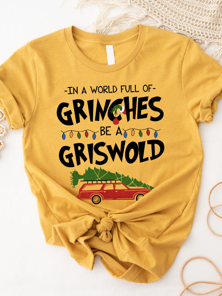 In a world full of Grinches Be a Griswold Graphic Tee
