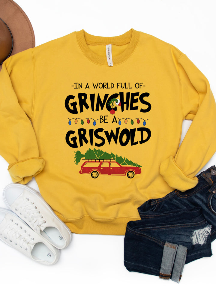 In A World Full Of Grinches, Be A Griswold Graphic Sweatshirt