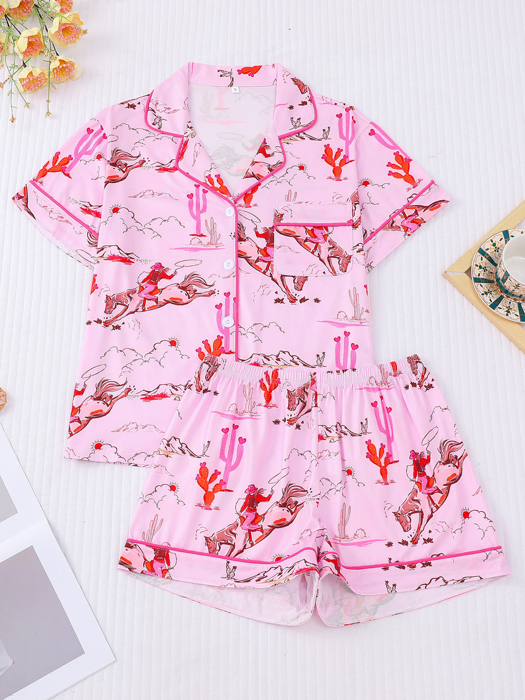 Pink pajama set with animal print on a light background