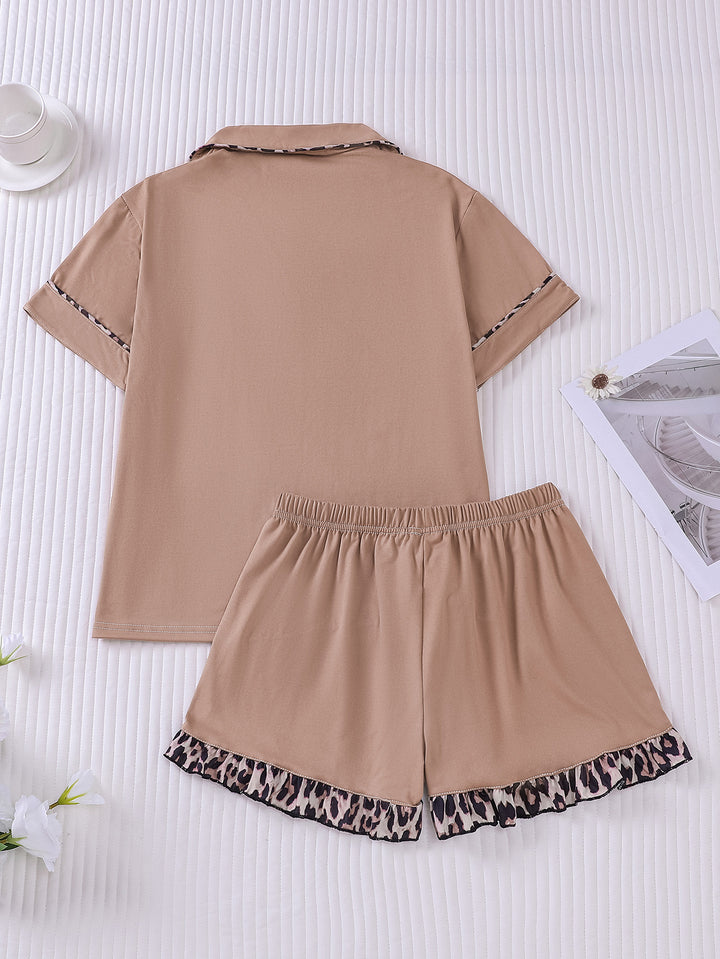 Brown pajama set with leopard print trim on a white background