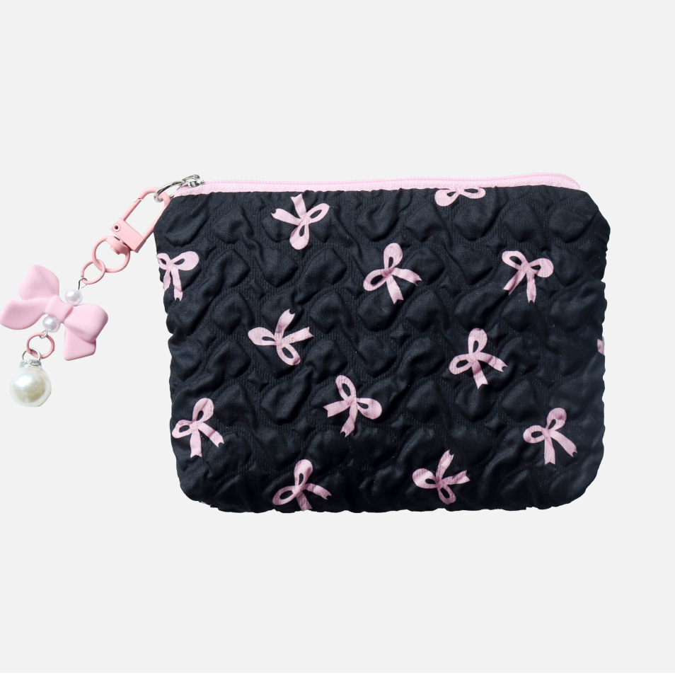 Black pouch with pink bows and a pink zipper on a white background