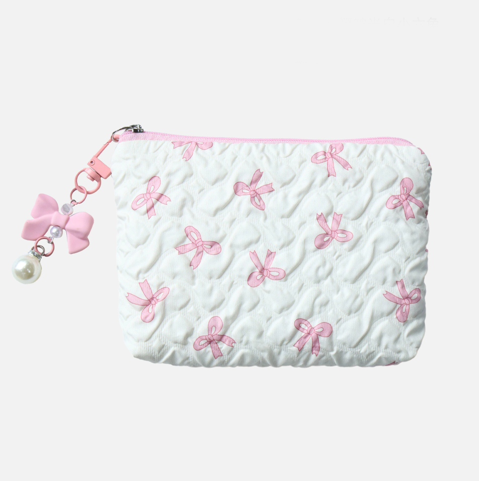 White pouch with pink bow patterns and a pink zipper on a white background