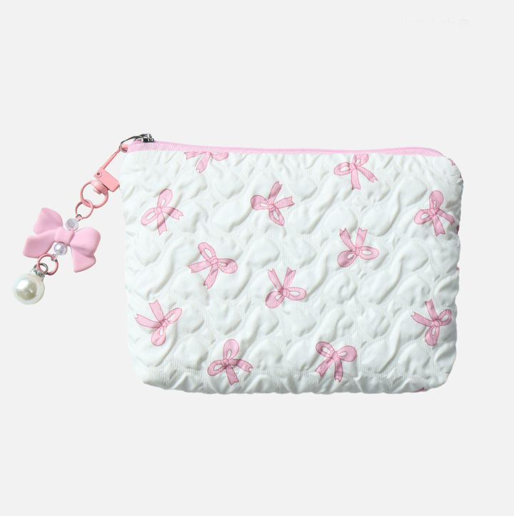 White pouch with pink bow patterns and a pink zipper on a white background