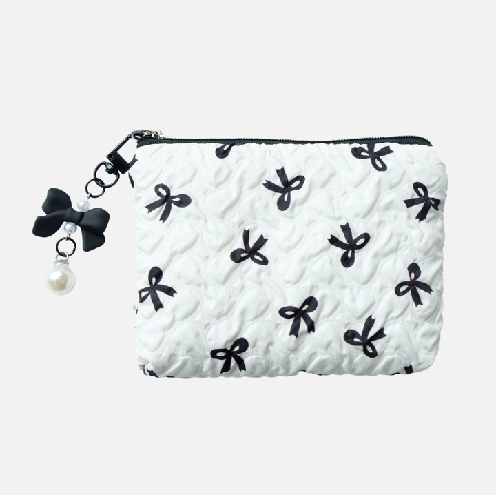 White pouch with black bow patterns on a white background