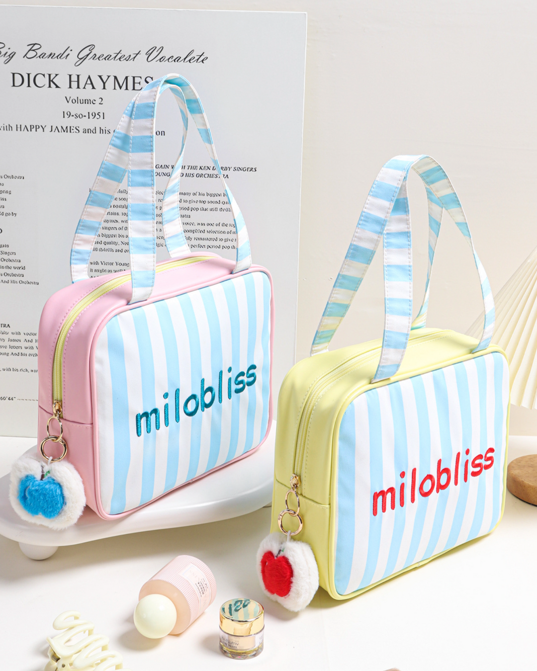 Two striped bags with 'milobliss' branding on a light background.