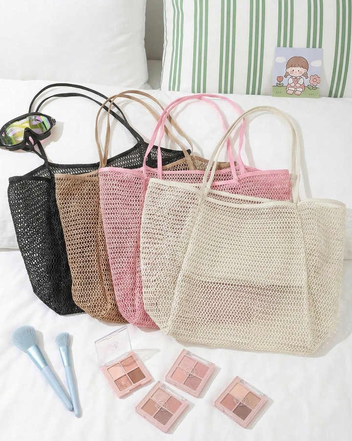Set of woven bags in various colors with makeup products on a white surface.