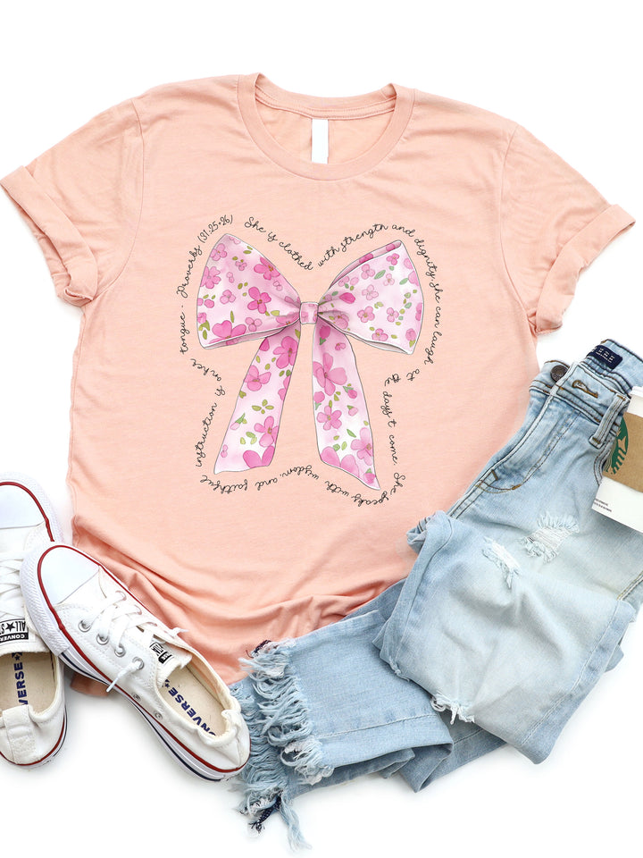 She is Clothed in Strength Floral Bow Graphic Tee