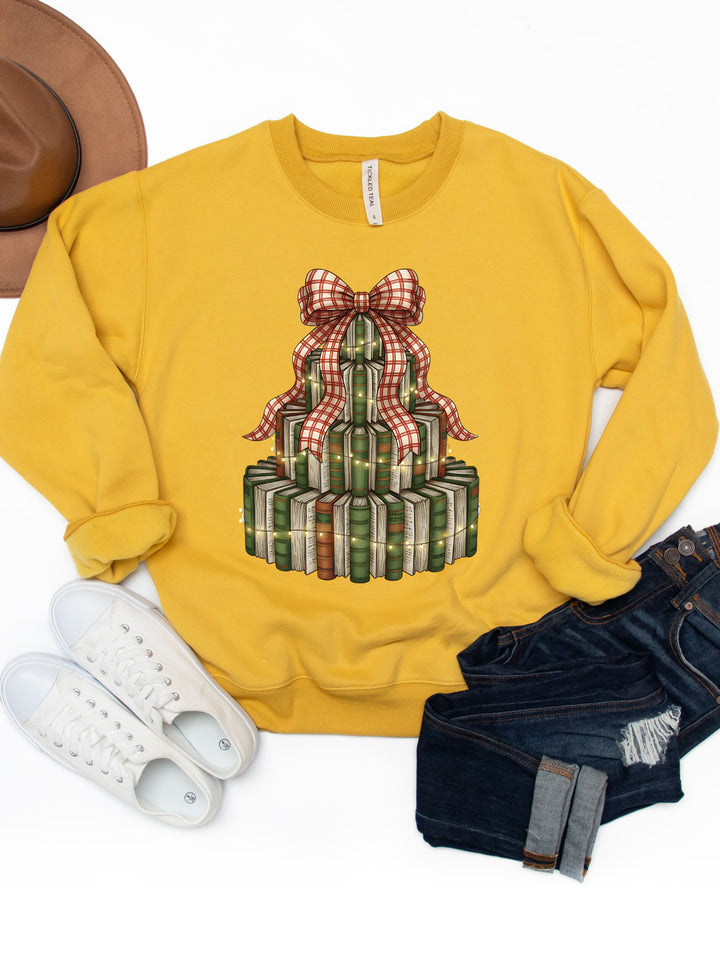 Yellow sweatshirt with Christmas-themed design, white sneakers, denim shorts, and a hat on a white background.