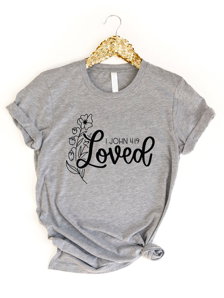Loved 1 John 4:19 Graphic Tee