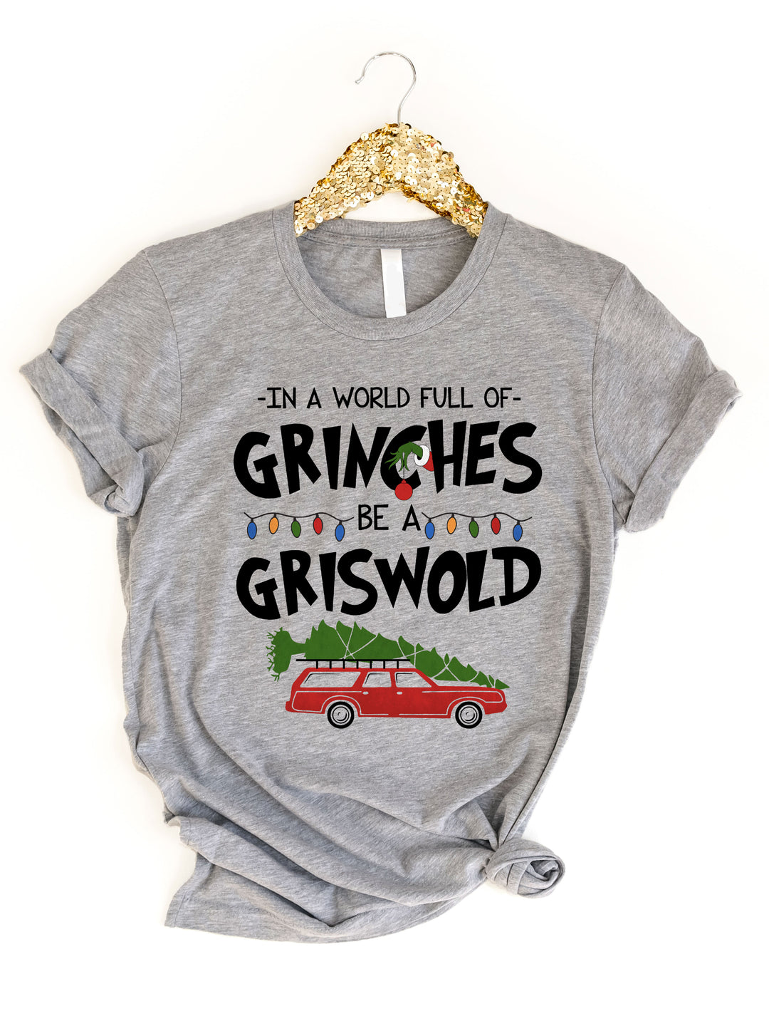 In a world full of Grinches Be a Griswold Graphic Tee